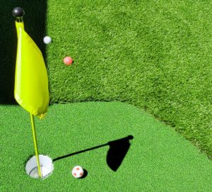Artificial turf can add fun designs to your yard such as your own putting green or mini golf course